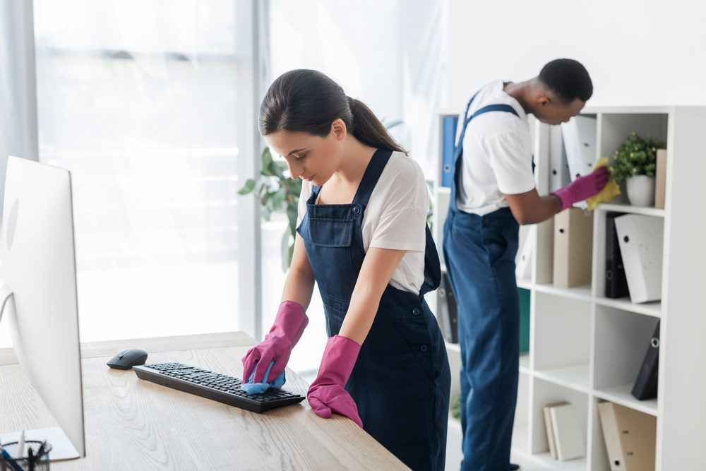 Commercial cleaners cleaning an office